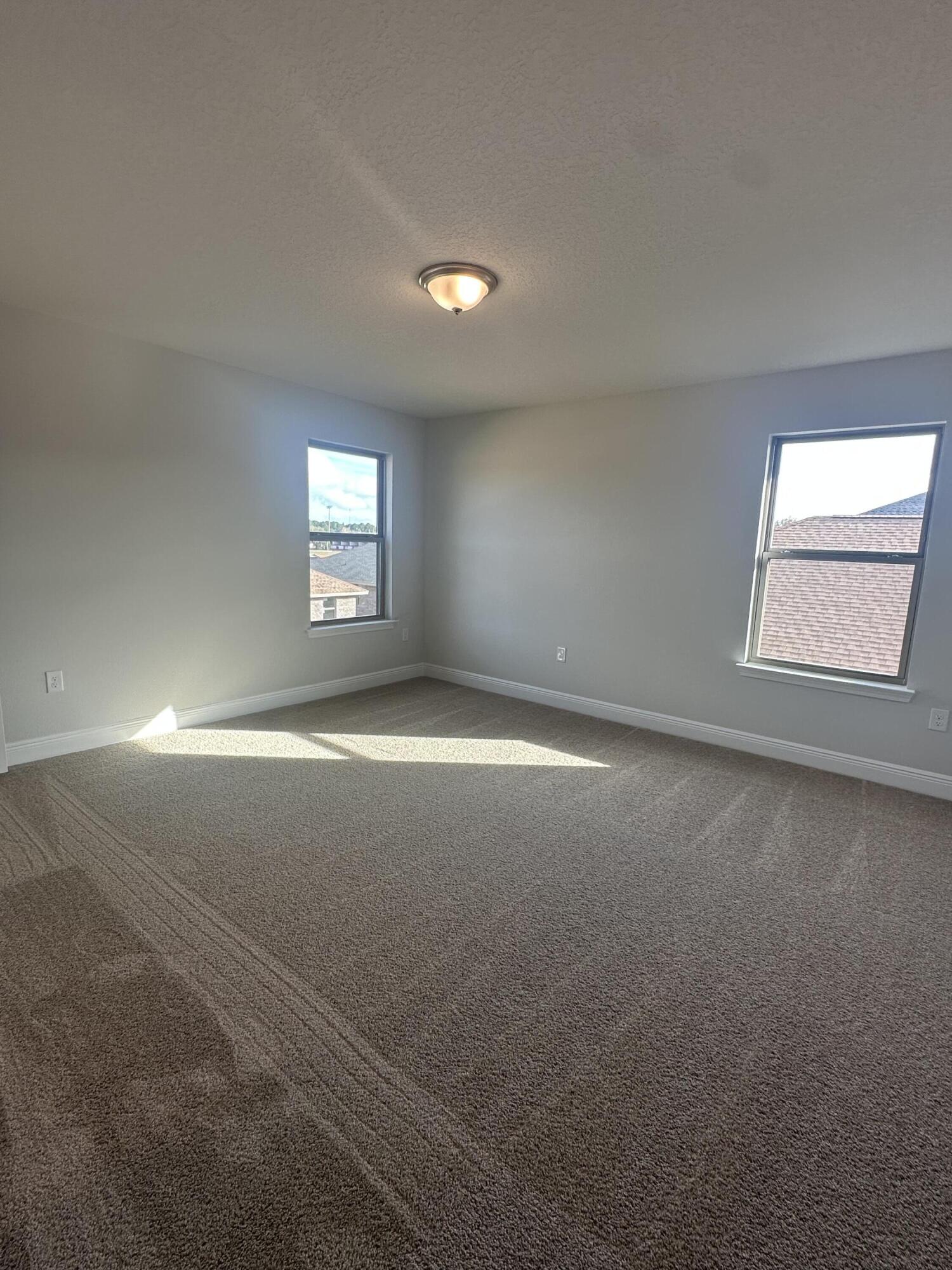 193 Ridgeway Circle Crestview, FL 32536 - Photo 23 of 33 an empty room with windows and windows