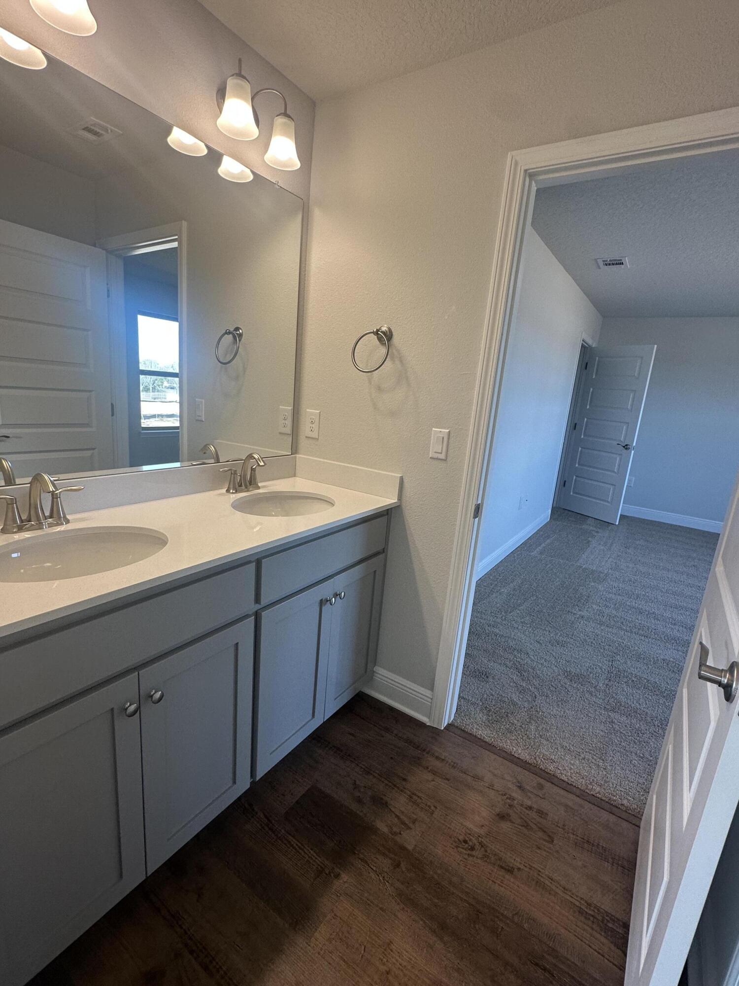193 Ridgeway Circle Crestview, FL 32536 - Photo 25 of 33 a spacious bathroom with a double vanity sink and a mirror