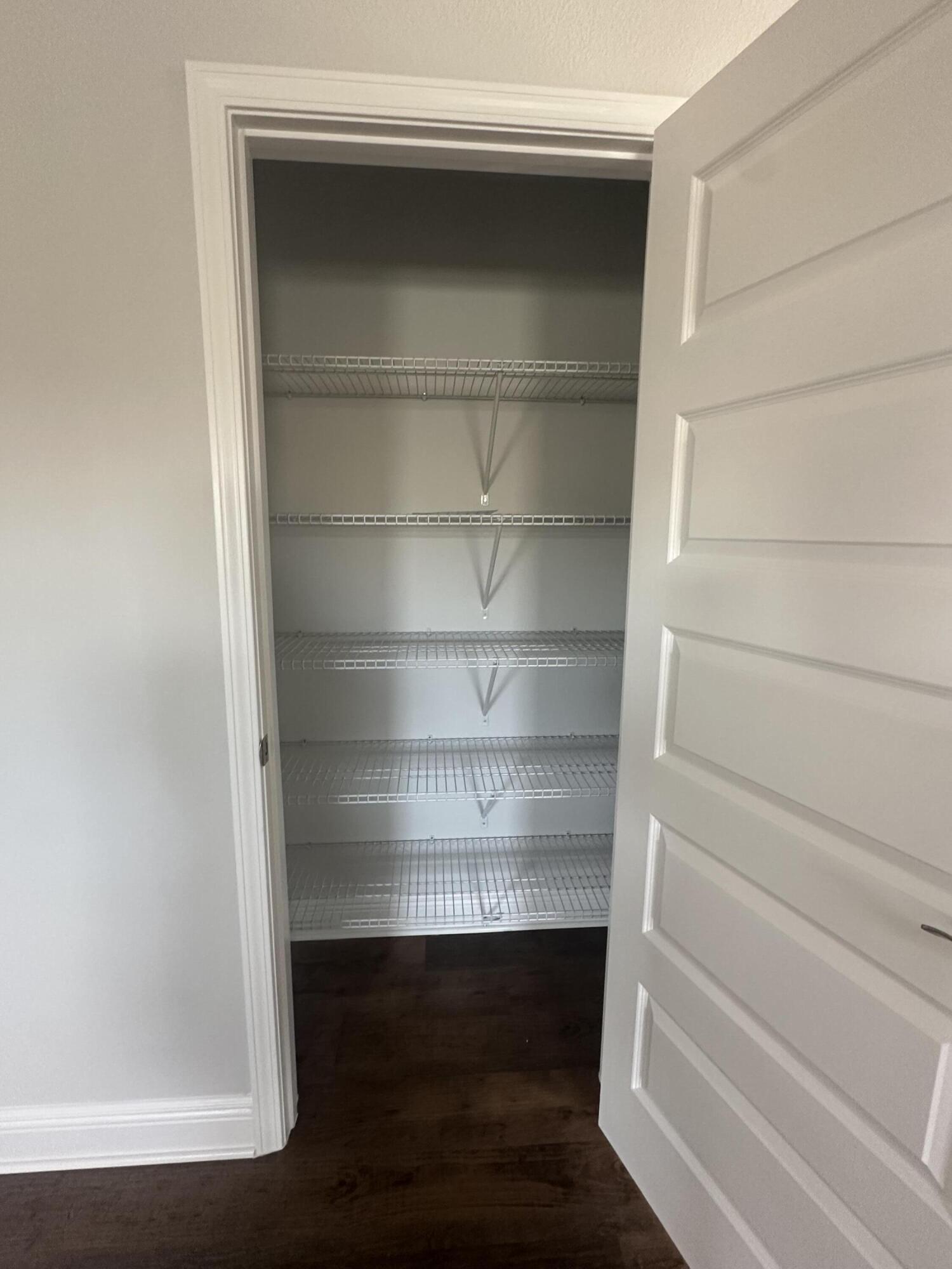 193 Ridgeway Circle Crestview, FL 32536 - Photo 28 of 33 a view of walk in closet with empty racks