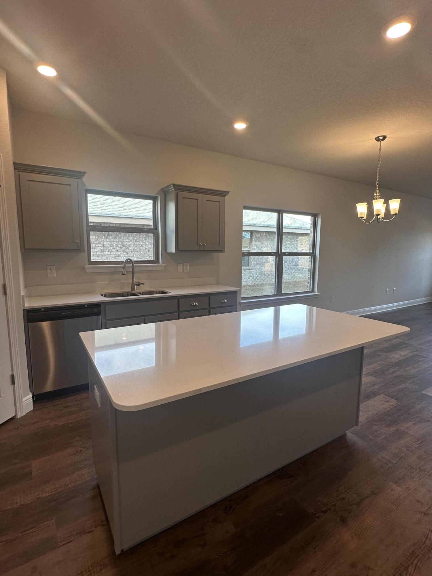 193 Ridgeway Circle Crestview, FL 32536 - Photo 8 of 33 a kitchen with kitchen island sink and window