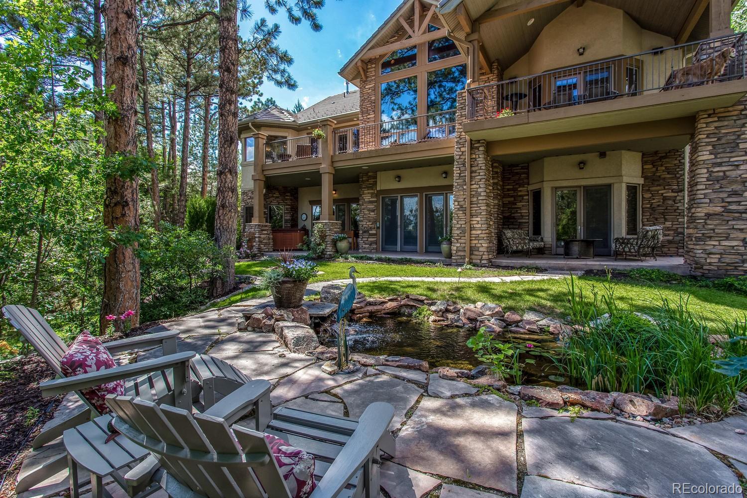 646 Ruby Trust Drive Castle Rock, CO 80108 - Photo 11 of 35 a view of a chairs and table in backyard of the house