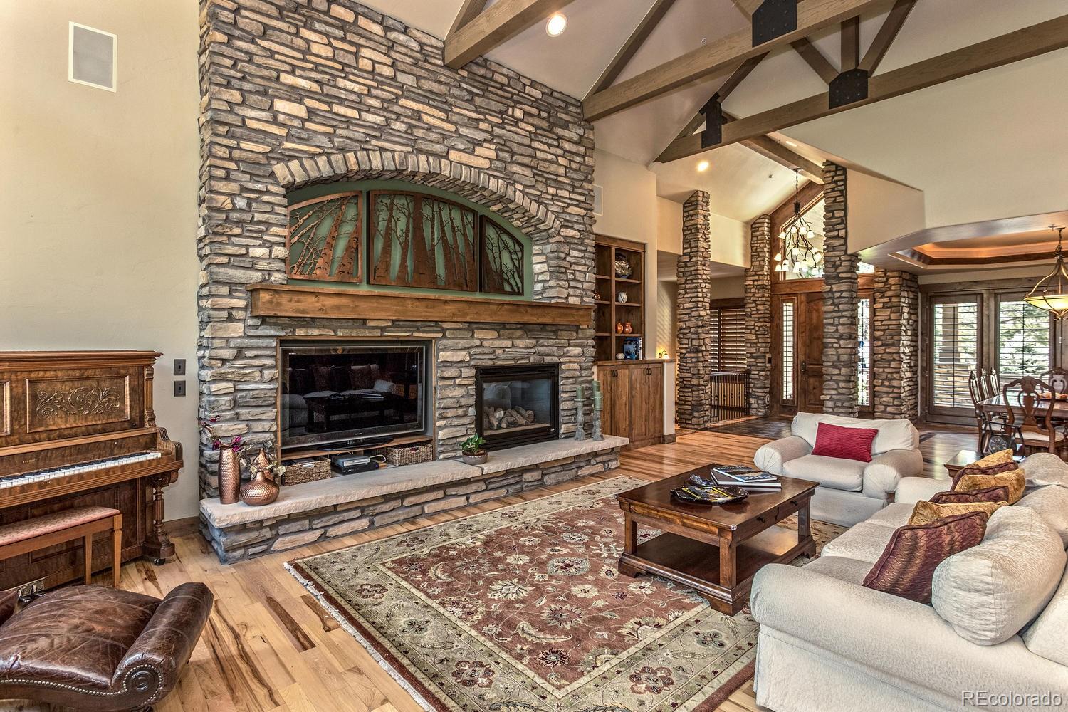 646 Ruby Trust Drive Castle Rock, CO 80108 - Photo 18 of 35 a living room with furniture and a fireplace