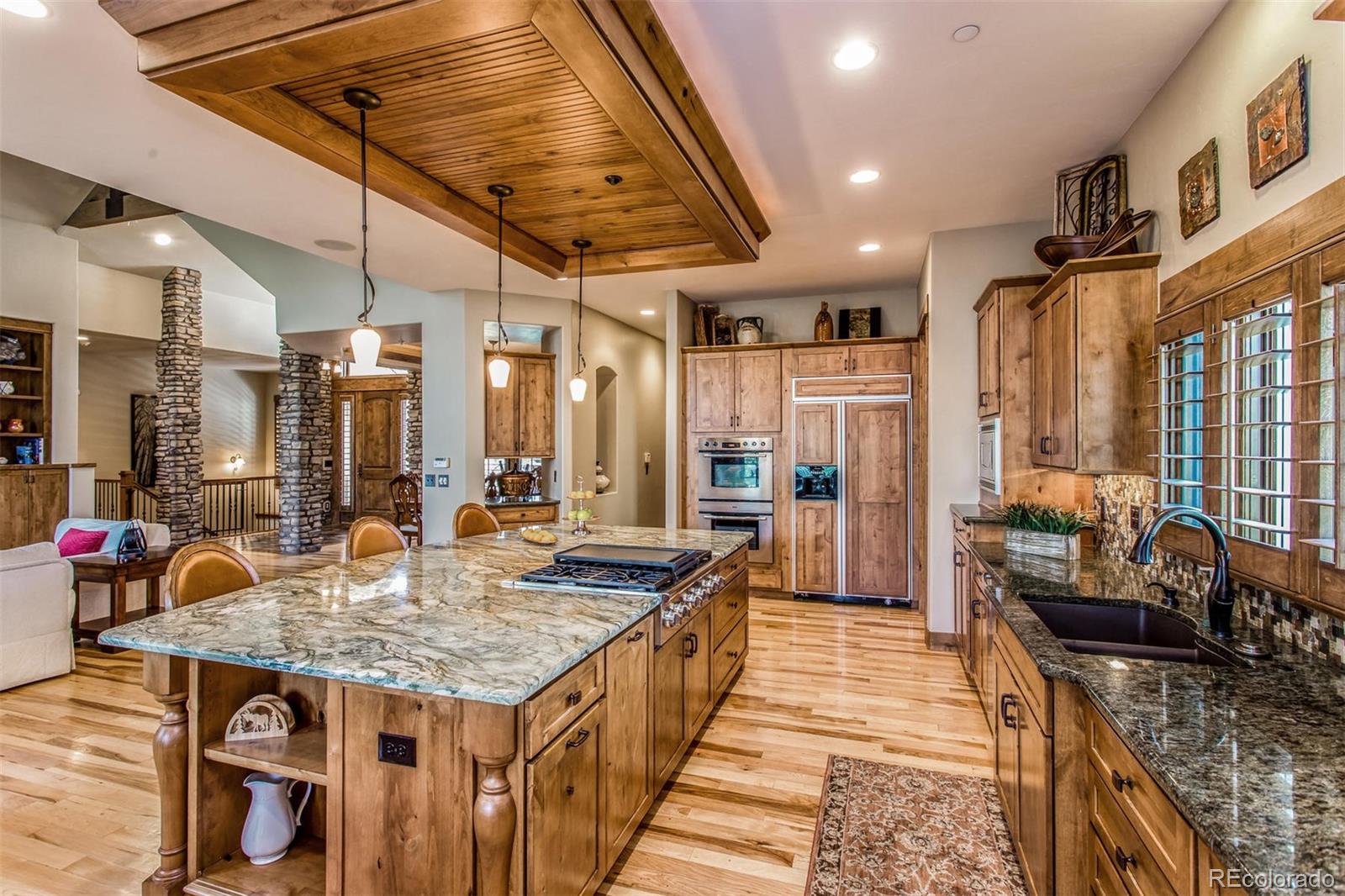 646 Ruby Trust Drive Castle Rock, CO 80108 - Photo 21 of 35 a kitchen with sink stove and refrigerator