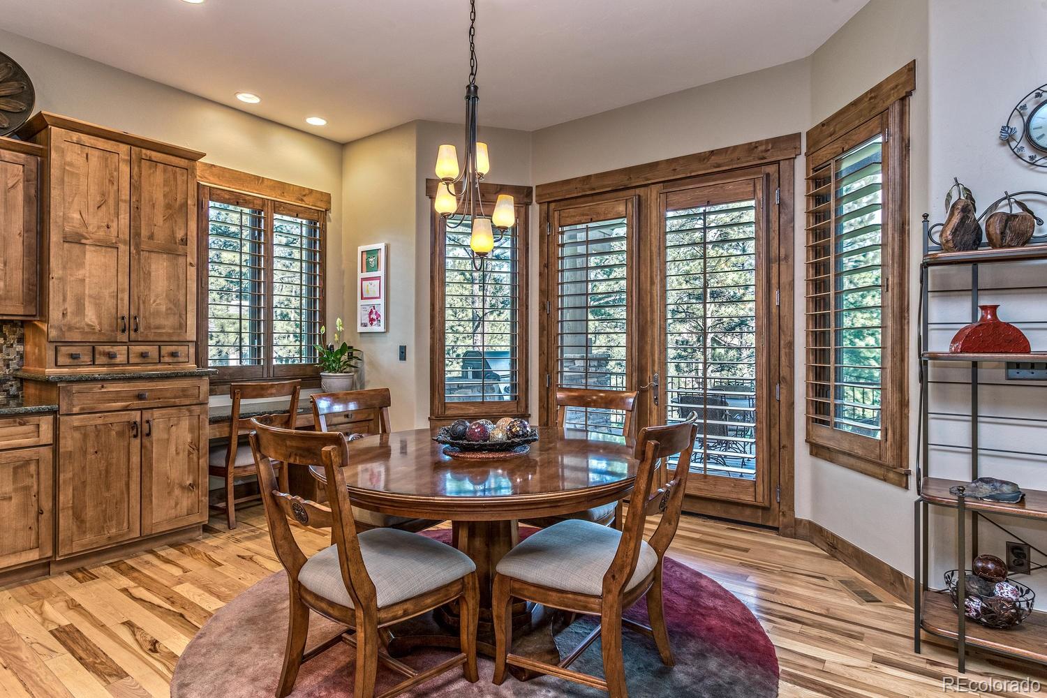 646 Ruby Trust Drive Castle Rock, CO 80108 - Photo 22 of 35 a view of a dining room with furniture window and outside view