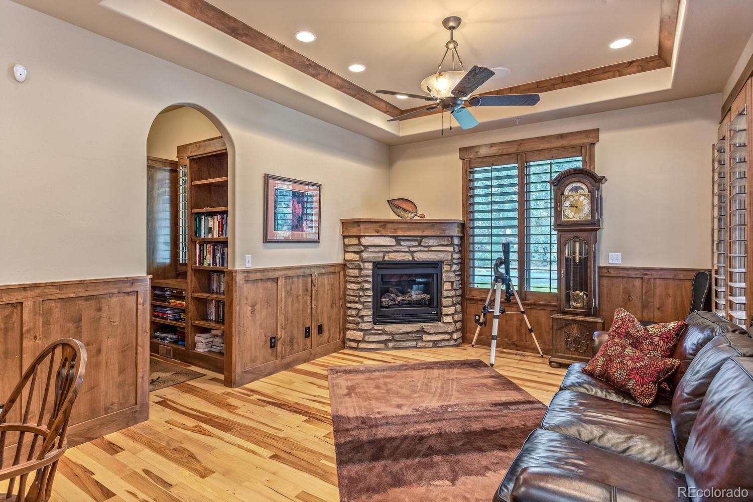 646 Ruby Trust Drive Castle Rock, CO 80108 - Photo 23 of 35 a living room with furniture and a fireplace