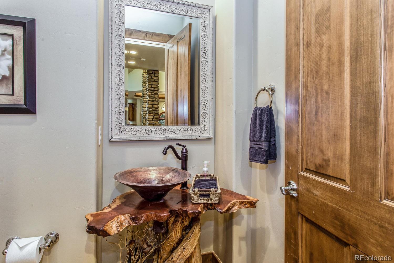 646 Ruby Trust Drive Castle Rock, CO 80108 - Photo 25 of 35 a bathroom with a sink and a mirror