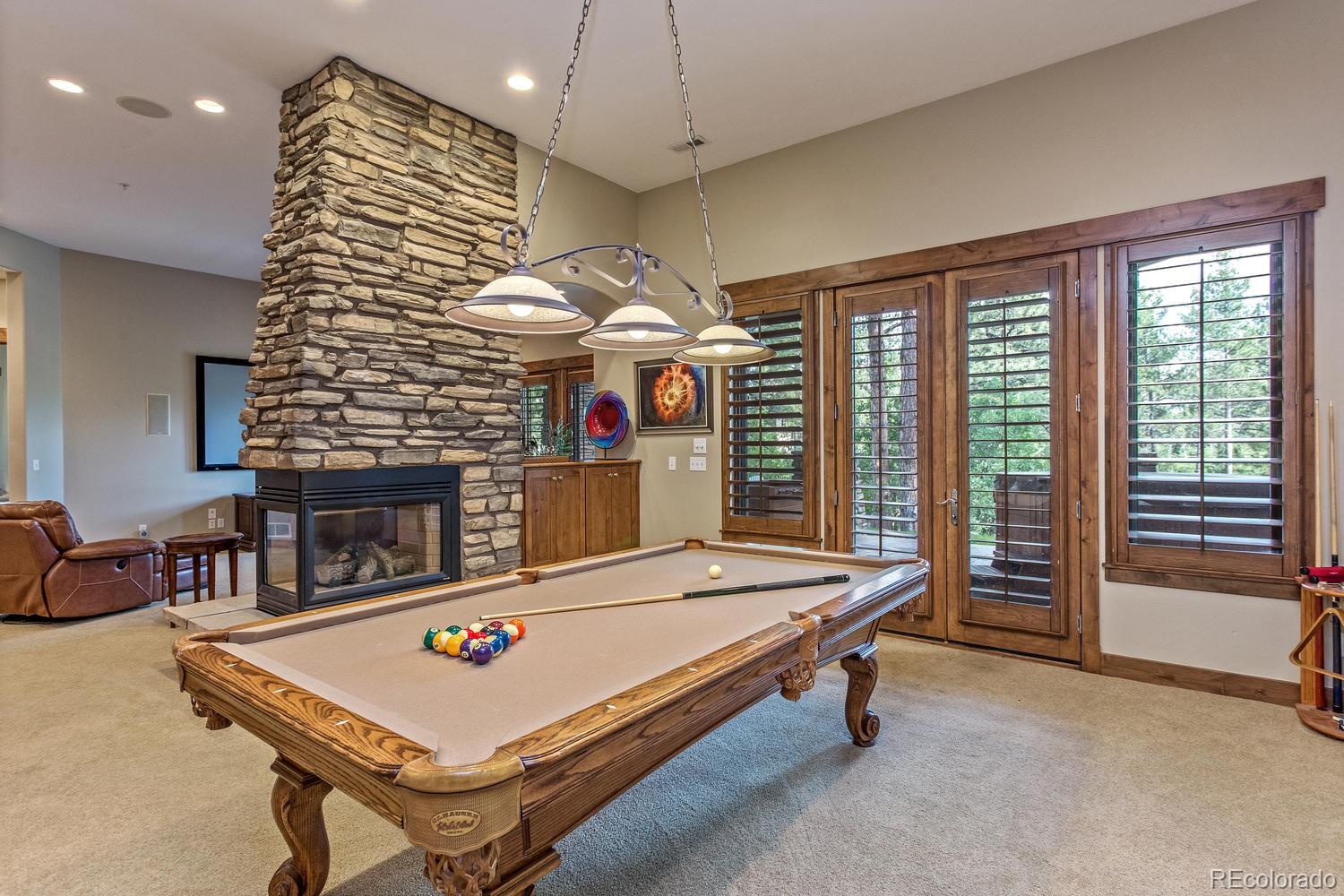 646 Ruby Trust Drive Castle Rock, CO 80108 - Photo 29 of 35 a living room with pool table