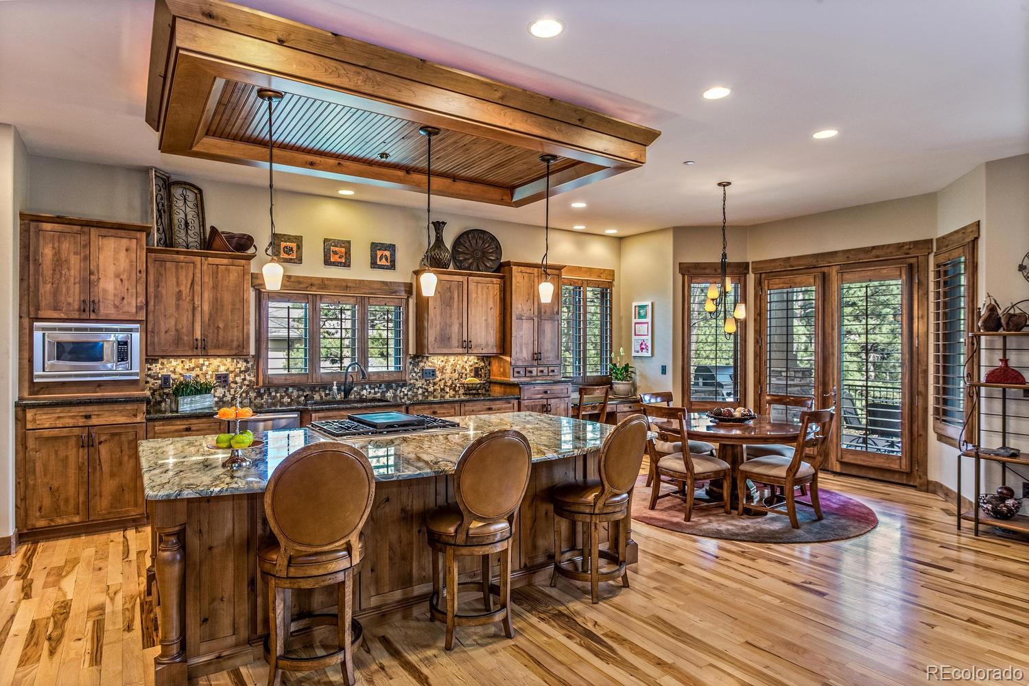 646 Ruby Trust Drive Castle Rock, CO 80108 - Photo 4 of 35 a view of a dining room with furniture window and wooden floor