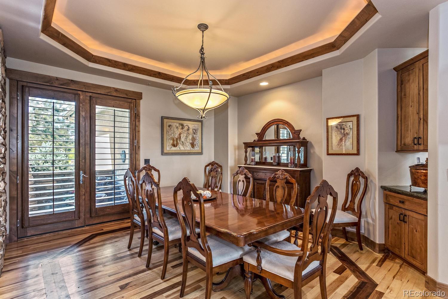 646 Ruby Trust Drive Castle Rock, CO 80108 - Photo 5 of 35 a view of a dining room with furniture window and wooden floor