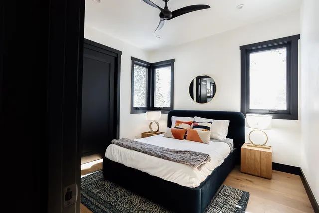 a bedroom with a bed and window