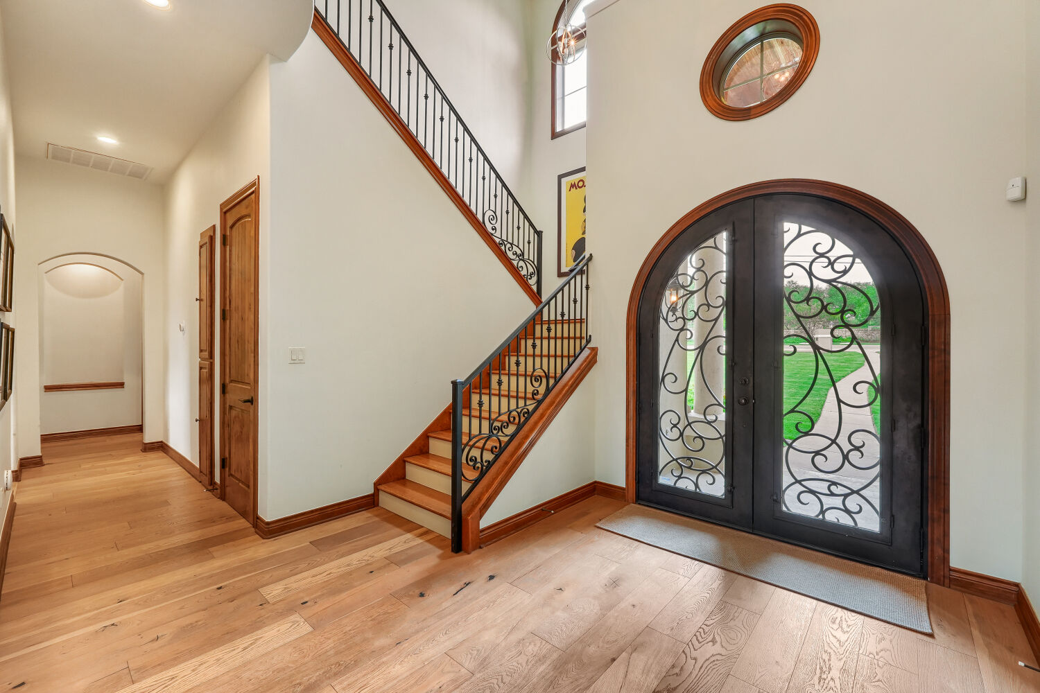 701 Hurst Creek Road Lakeway, TX 78734 - Photo 6 of 37 Entryway with unique front door and updated flooring