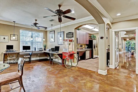 a living room with lots of furniture and a large window
