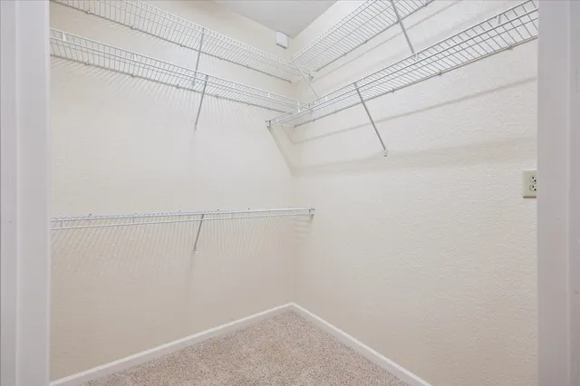 a view of a room with racks on the wall