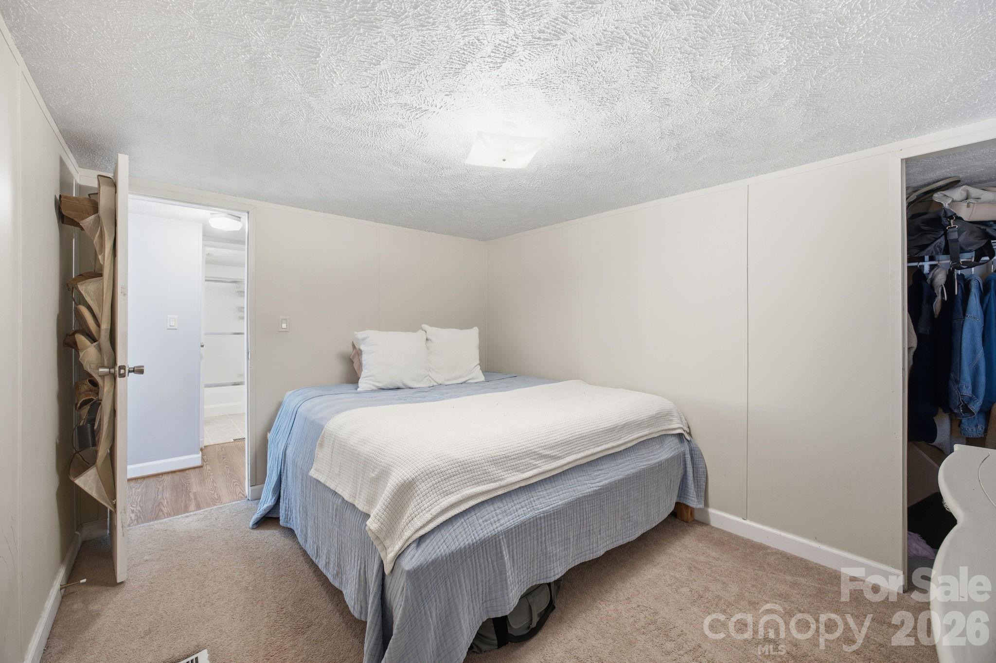 675 Overcash Road Salisbury, NC 28147 - Photo 28 of 48 a bed sitting in a bedroom next to a window