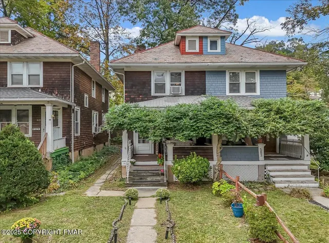 front view of a house with a yard