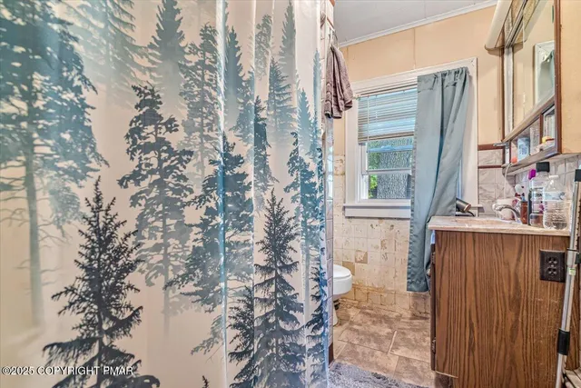 a view of a house with a tree