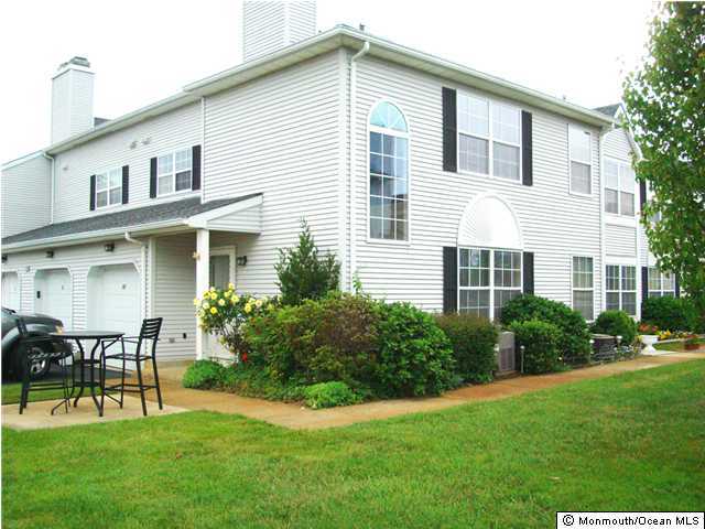 12 Racquet Road Wall, NJ 07719 - Photo 1 of 3 a view of an house with backyard space and garden