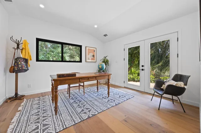 a work room with furniture and a window