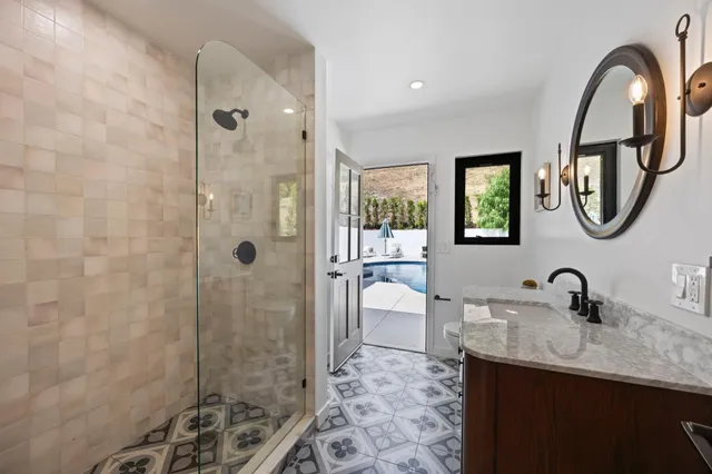 a bathroom with a toilet sink and shower