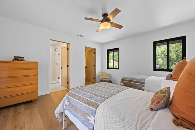 a bedroom with a bed and a dresser