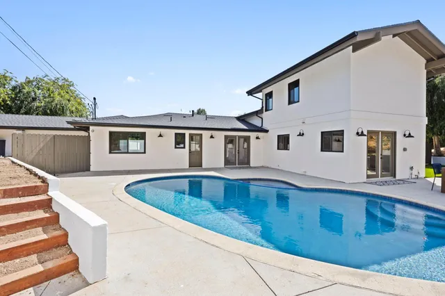 a front view of a house with swimming pool