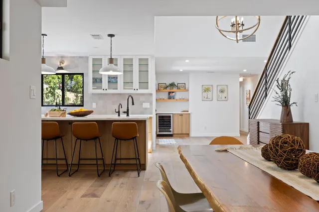 a living room with furniture a window and a chandelier