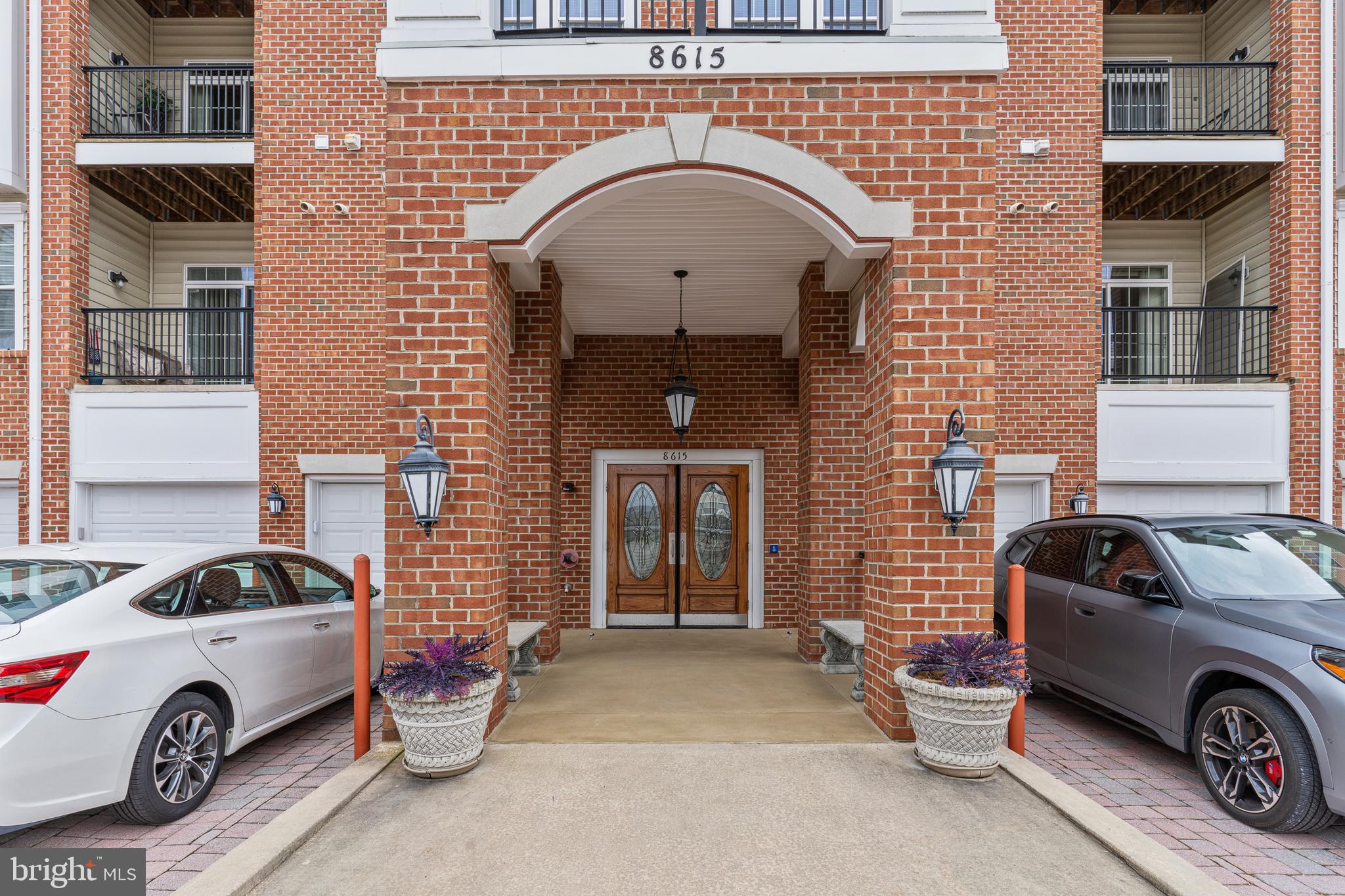 8615 Wandering Fox Trail, Unit 208 Odenton, MD 21113 - Photo 1 of 19 a front view of a house with parking space