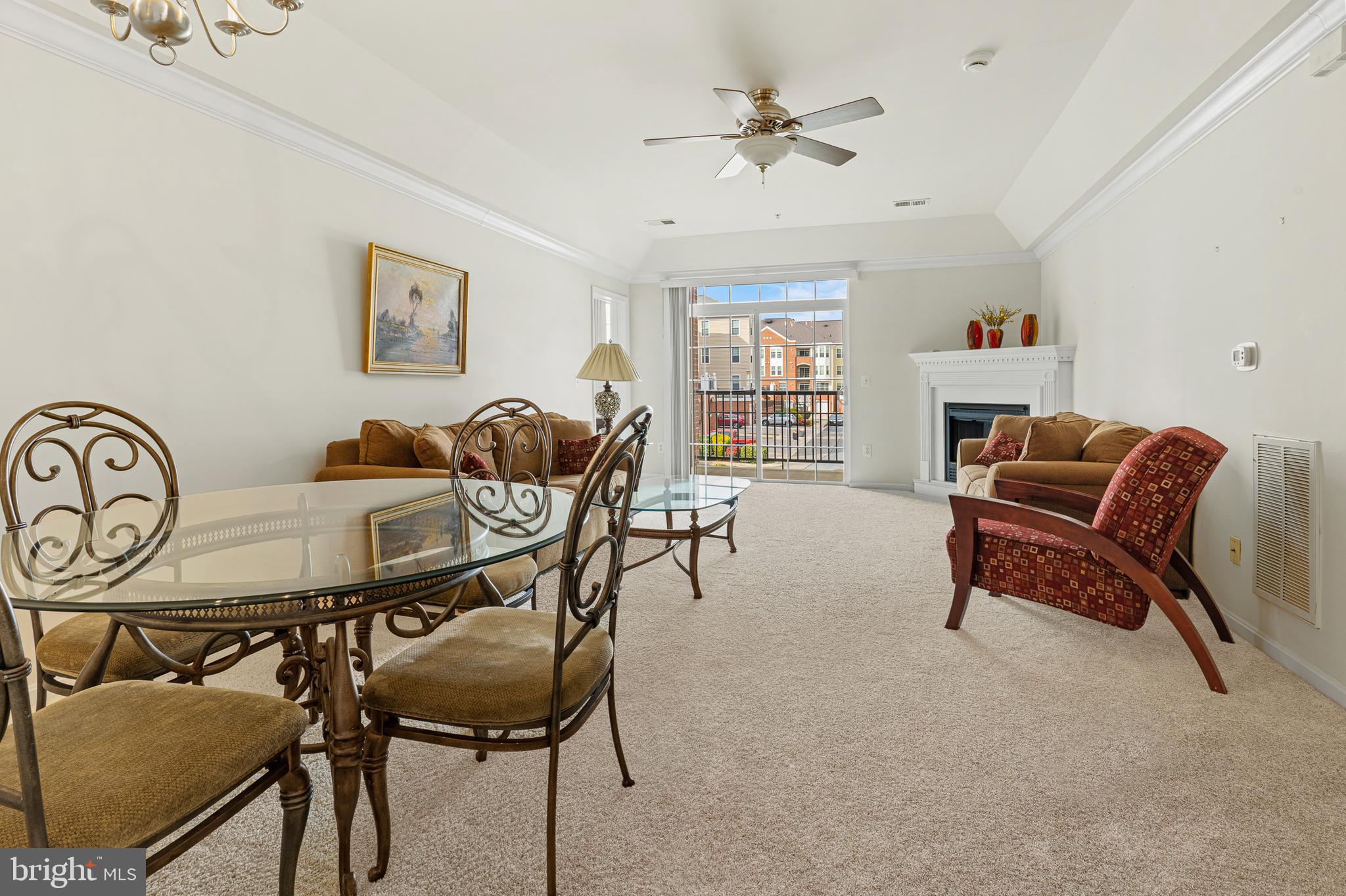 8615 Wandering Fox Trail, Unit 208 Odenton, MD 21113 - Photo 13 of 28 a living room with furniture and a flat screen tv