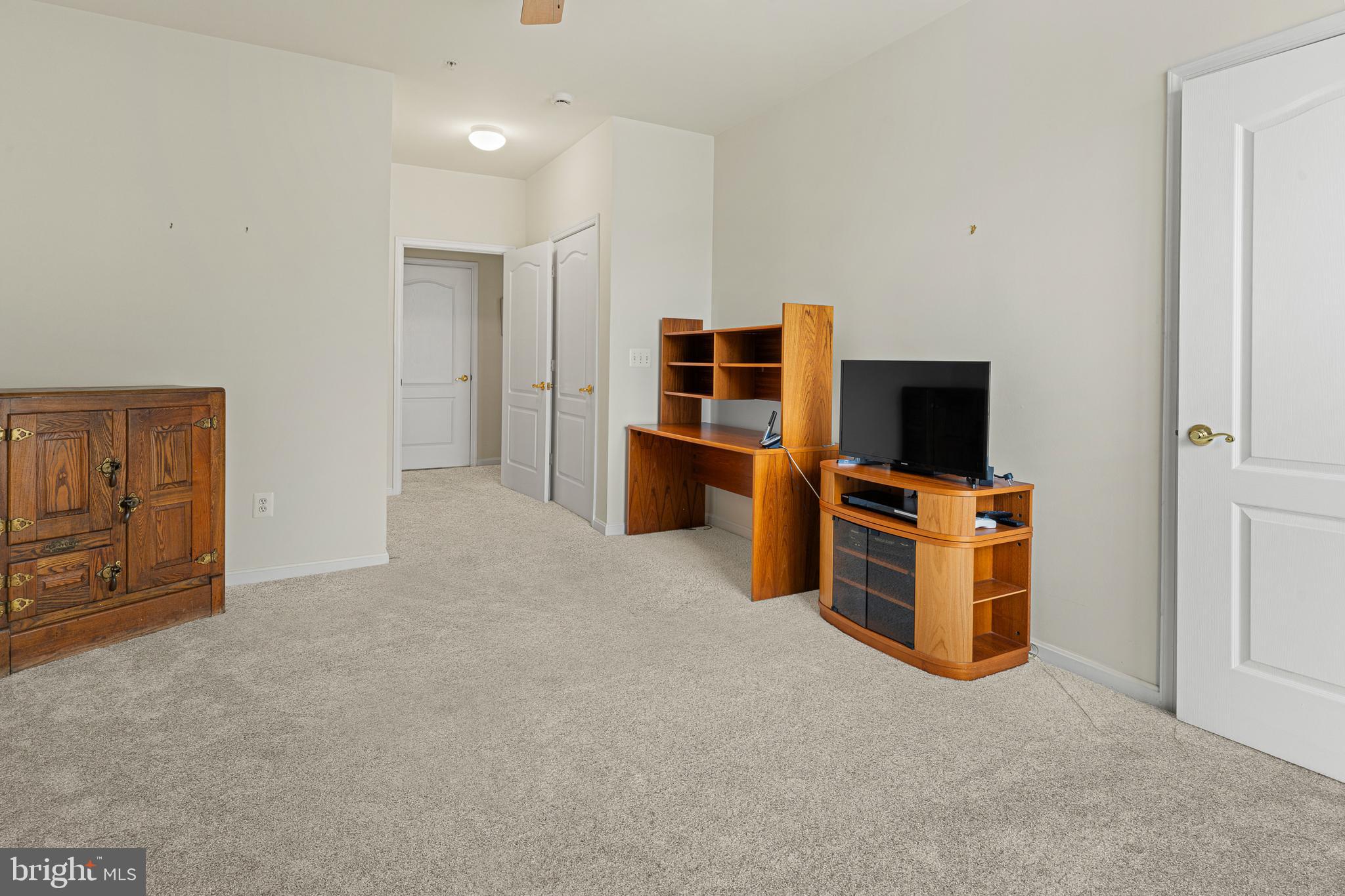 8615 Wandering Fox Trail, Unit 208 Odenton, MD 21113 - Photo 13 of 19 a view of room with flat screen tv