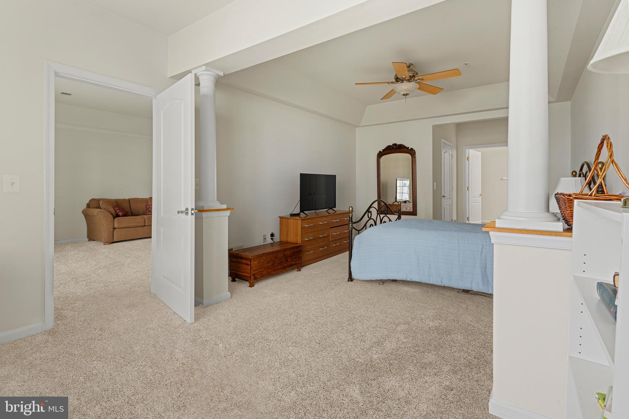 8615 Wandering Fox Trail, Unit 208 Odenton, MD 21113 - Photo 13 of 22 a bed room with a bed and a television