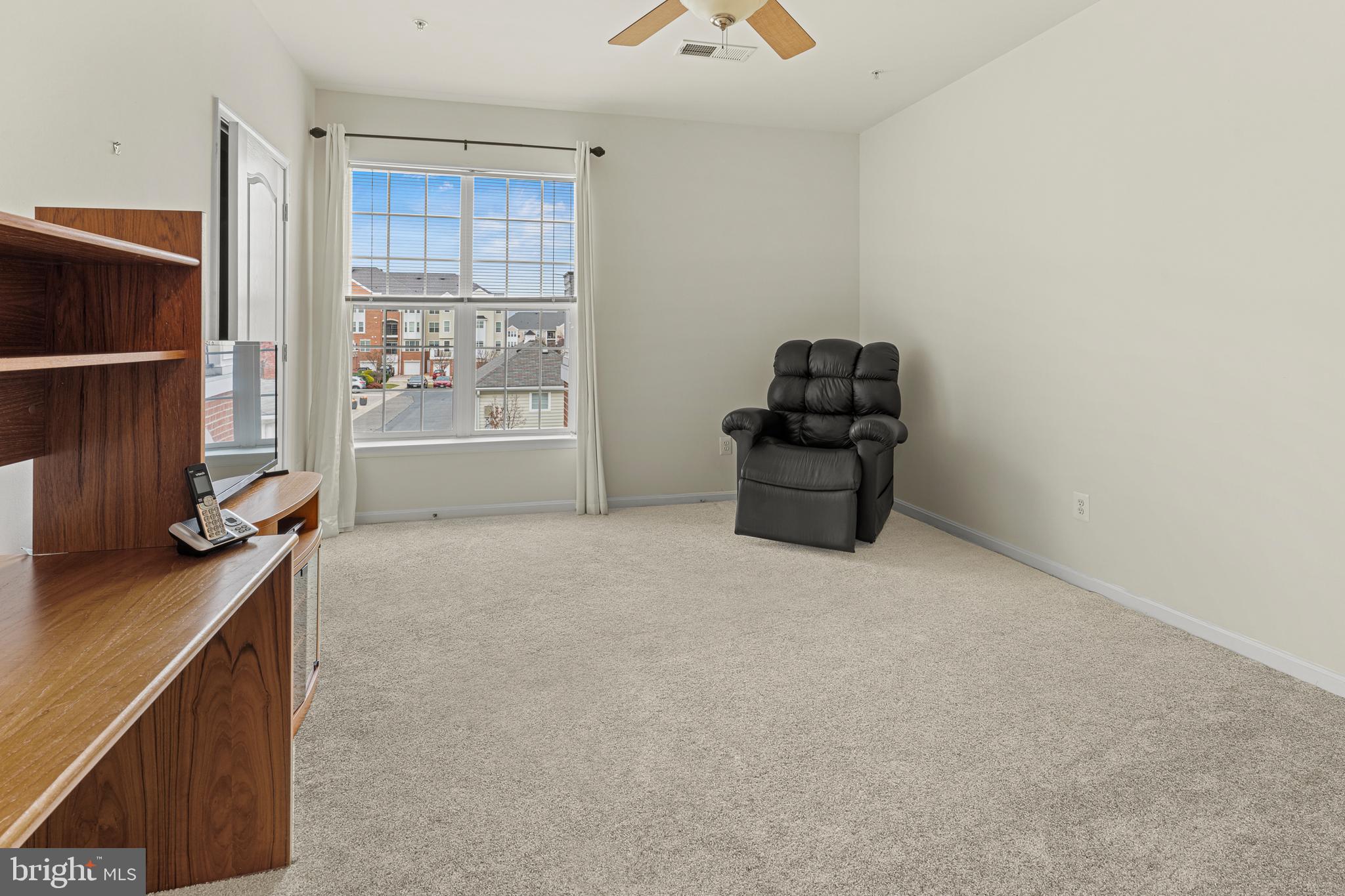 8615 Wandering Fox Trail, Unit 208 Odenton, MD 21113 - Photo 18 of 28 a workspace with furniture and window
