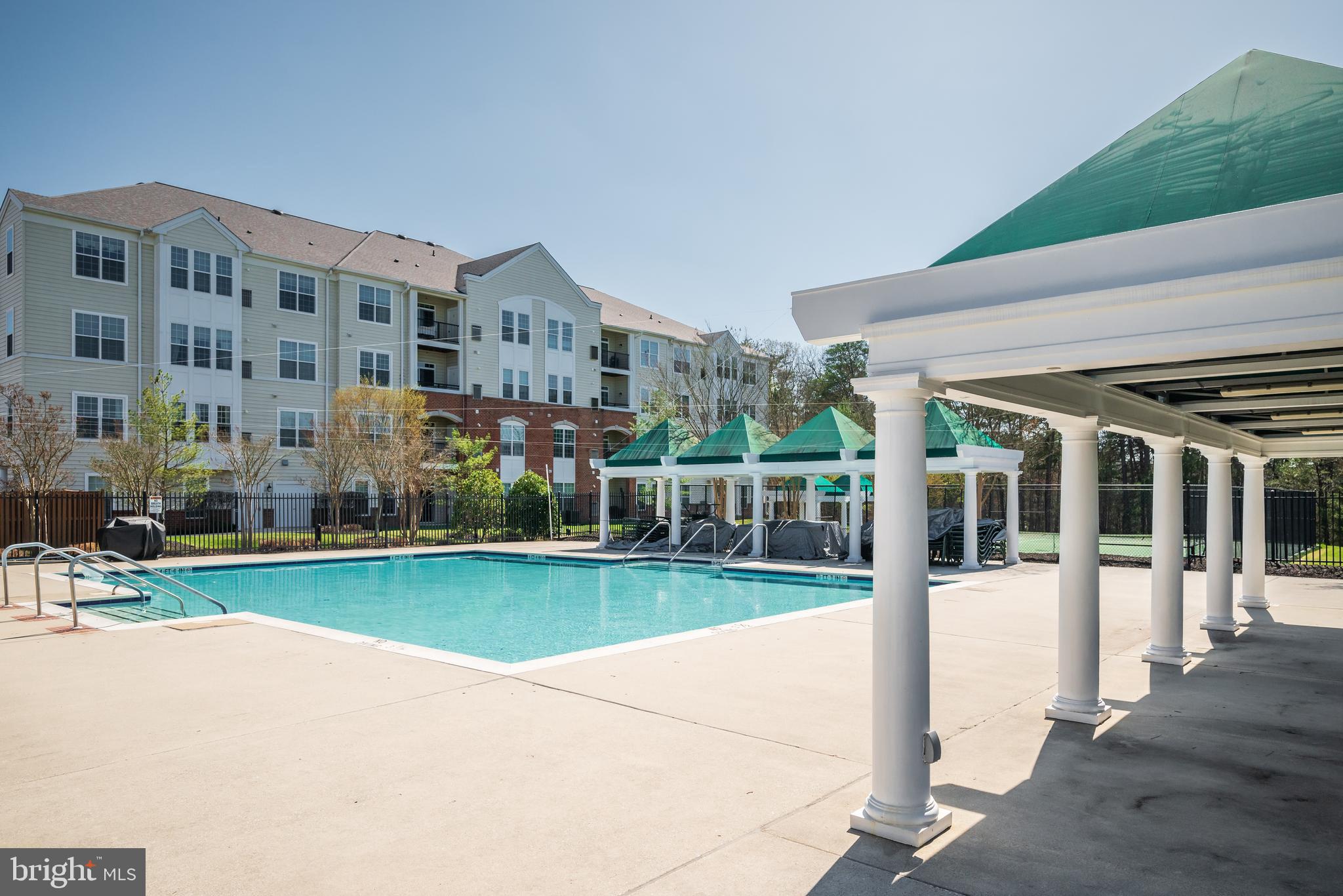 8615 Wandering Fox Trail, Unit 208 Odenton, MD 21113 - Photo 25 of 28 a view of a building with a yard