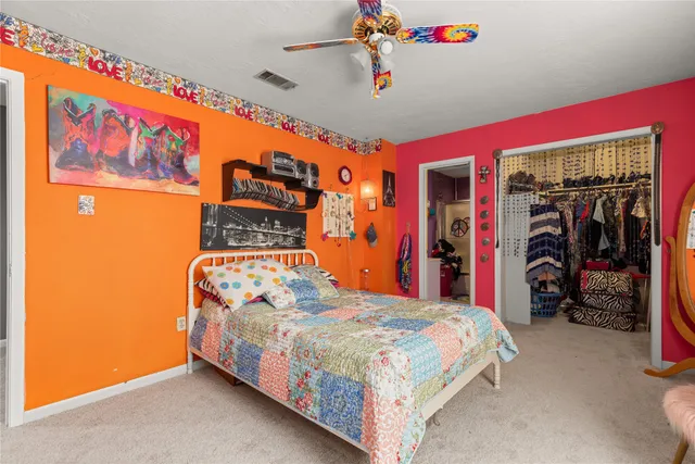 a bedroom with a bed and a walk in closet