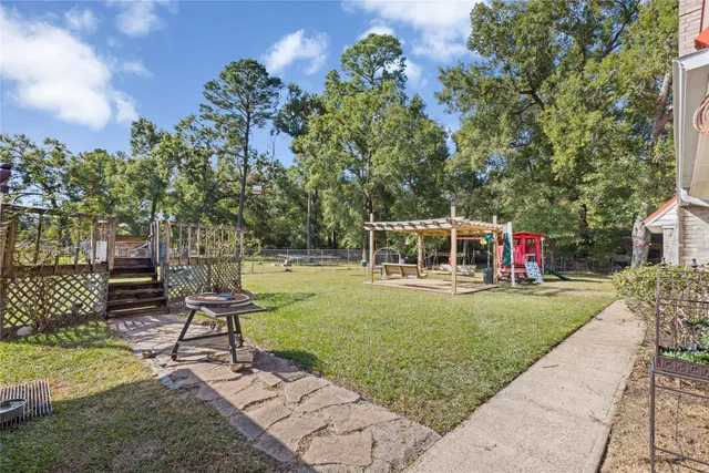 a view of a chair and table in the garden