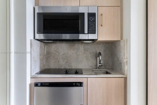 a spacious bedroom with a bed and a flat screen tv