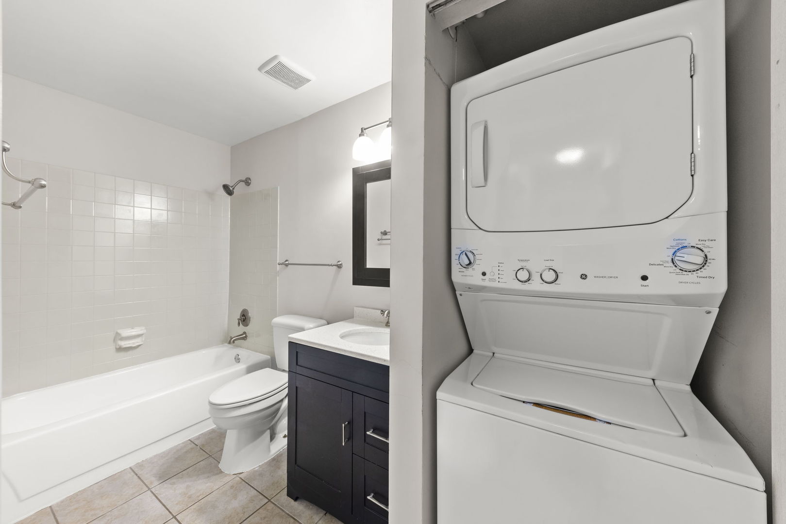 1324 McDowell Road, Unit 104 Naperville, IL 60563 - Photo 13 of 20 a bathroom with a toilet sink and bathtub