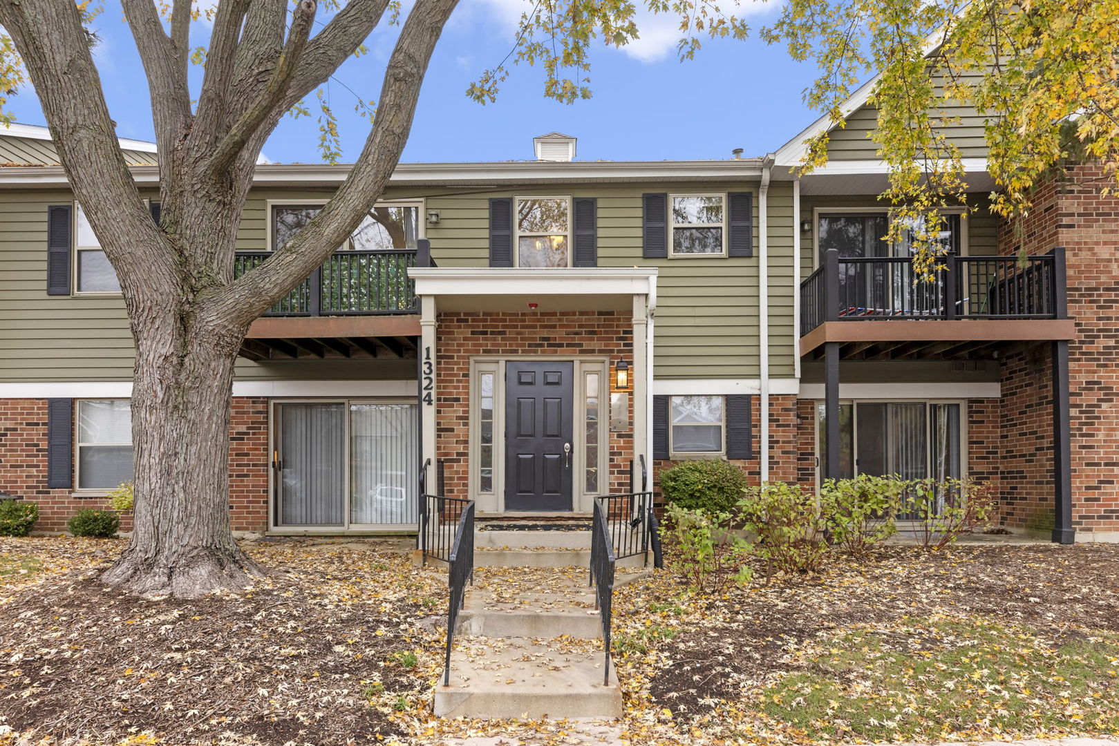 1324 McDowell Road, Unit 104 Naperville, IL 60563 - Photo 20 of 20 a front view of a house with garden