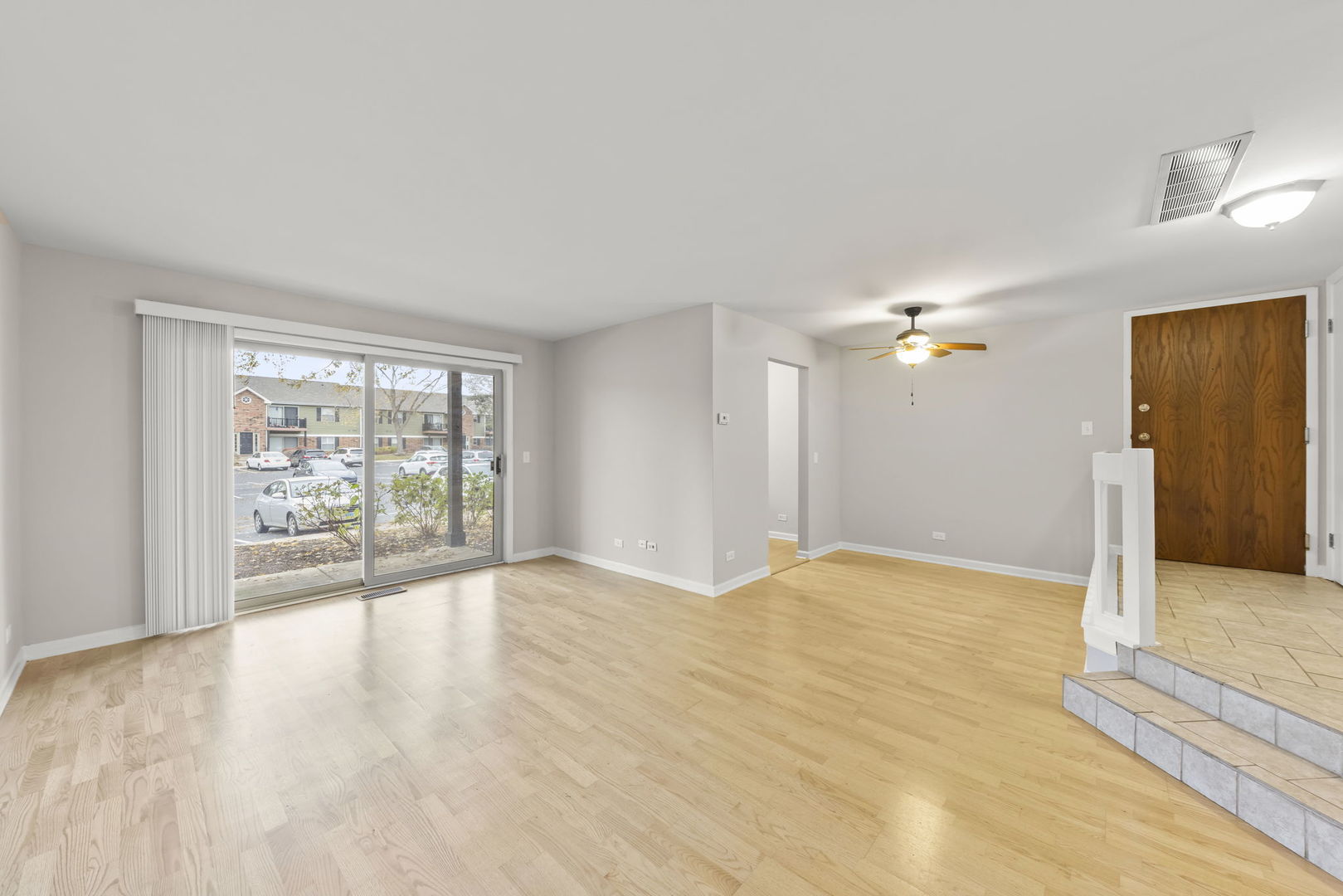 1324 McDowell Road, Unit 104 Naperville, IL 60563 - Photo 2 of 20 a view of an empty room with a window
