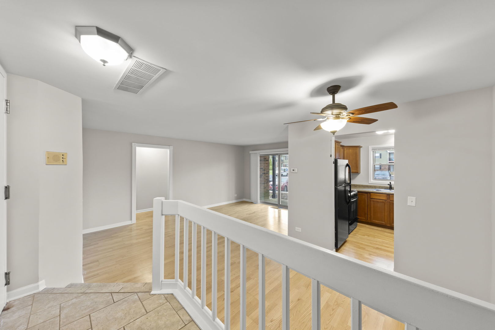 1324 McDowell Road, Unit 104 Naperville, IL 60563 - Photo 3 of 20 a view of a hallway with a chandelier