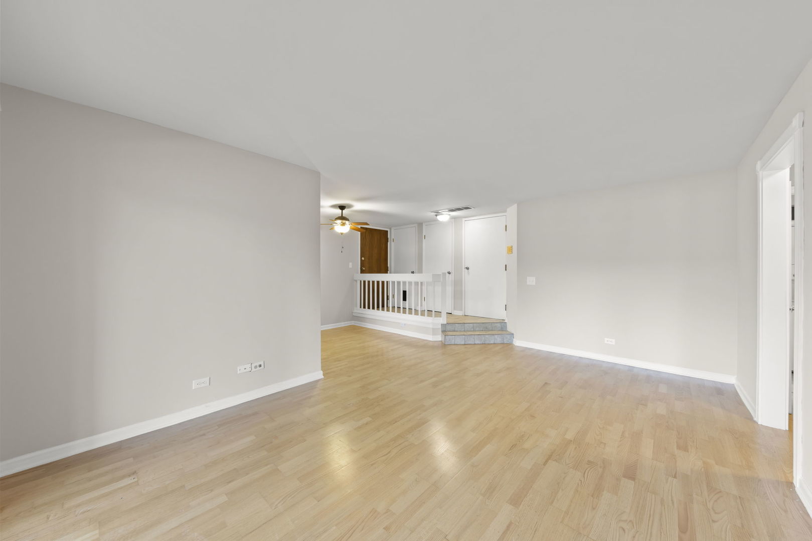 1324 McDowell Road, Unit 104 Naperville, IL 60563 - Photo 5 of 20 a big room with wooden floor and windows