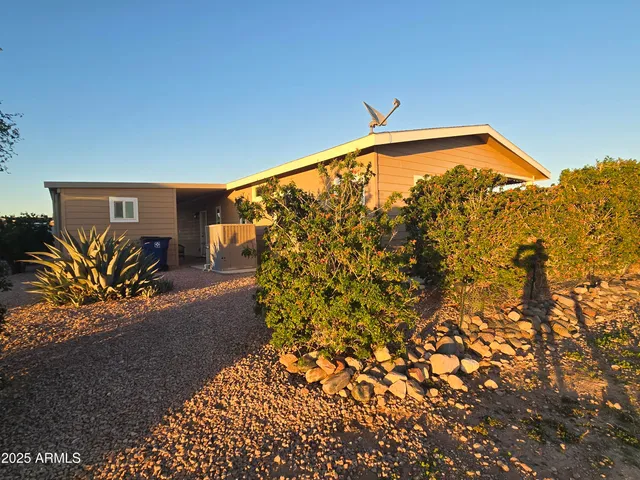 a living room with furniture windows and a flat screen tv