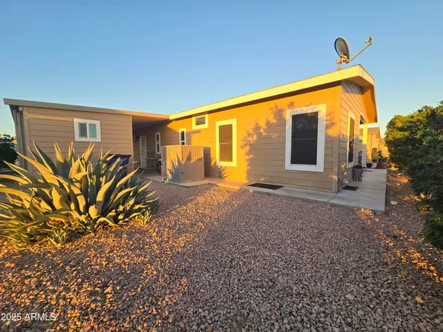 a living room with furniture ceiling fan and a flat screen tv