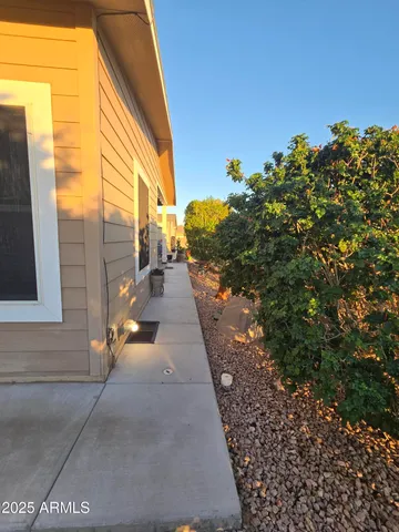 a living room with furniture ceiling fan and a flat screen tv
