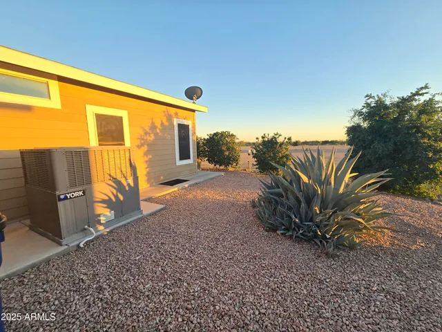 a bed room with furniture and a flat screen tv