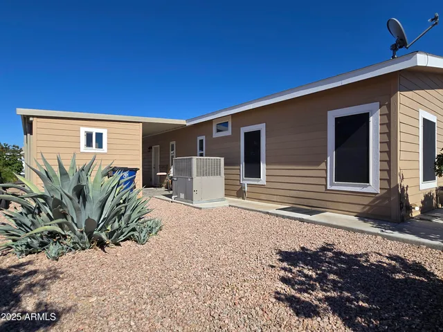 a kitchen with stainless steel appliances granite countertop a sink and a refrigerator