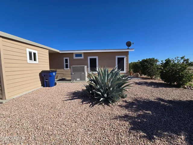 a kitchen with kitchen island a sink and stove
