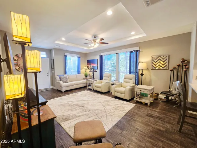 a spacious bedroom with a bed and a flat screen tv