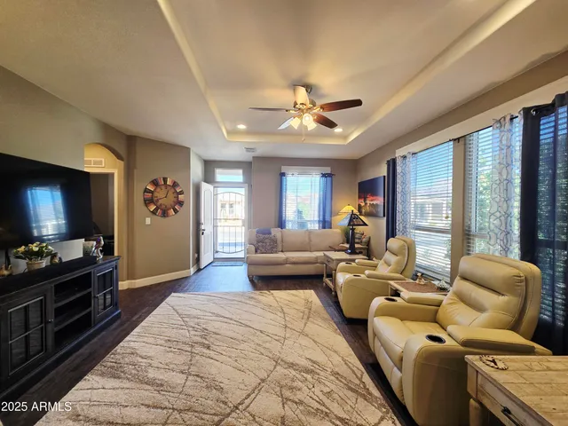 a bedroom with a bed and painting on the wall