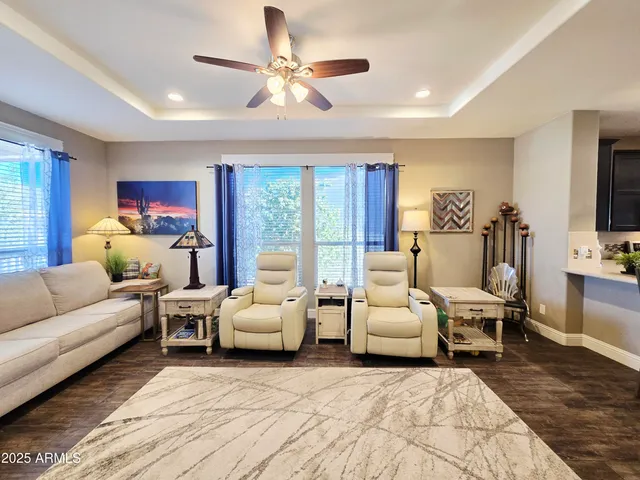 a view of walk in closet with clothes