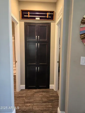 a living room with lots of furniture and clutter